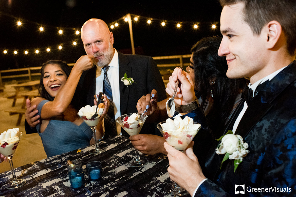 guests-eat-dessert-at-outdoor-wedding-venue