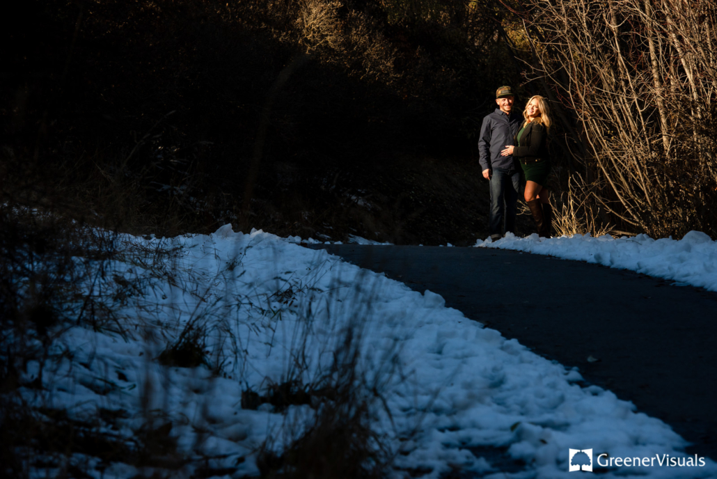 engaged-couple-smile-on-trail-Greenough-Park