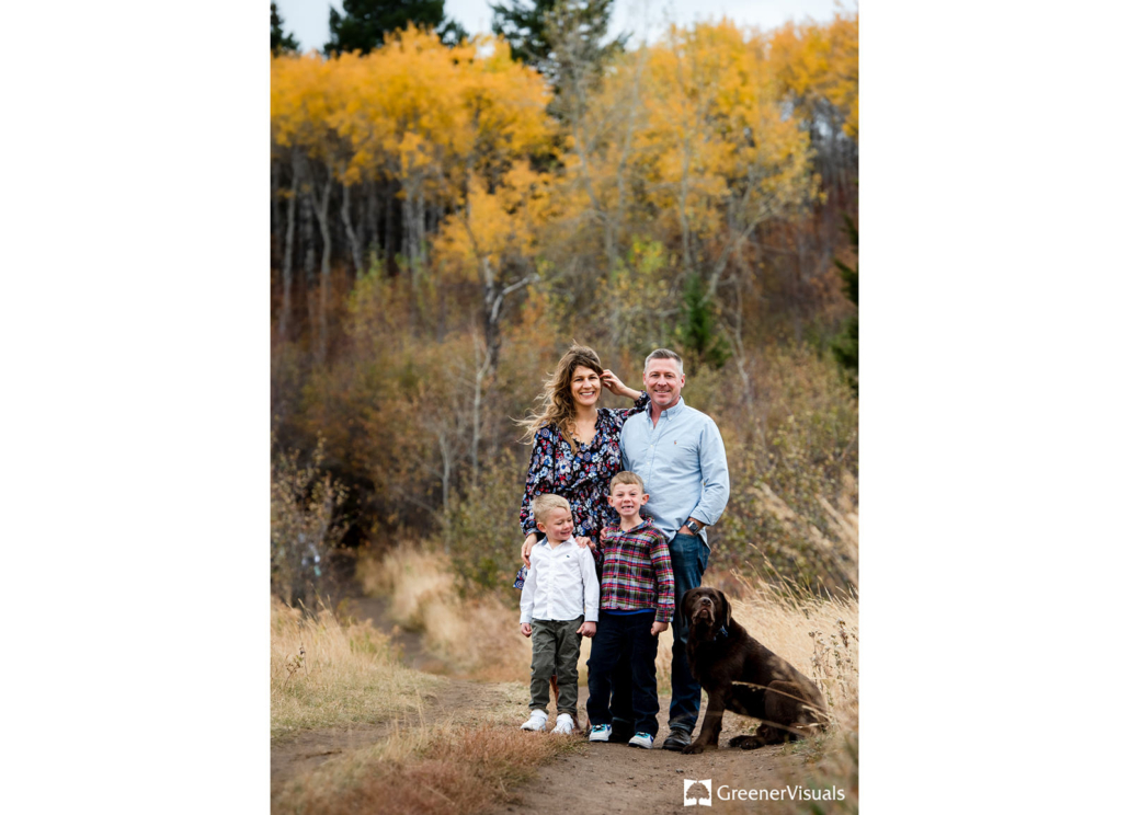 young-family-with-dog-against-yellow-fall-colors