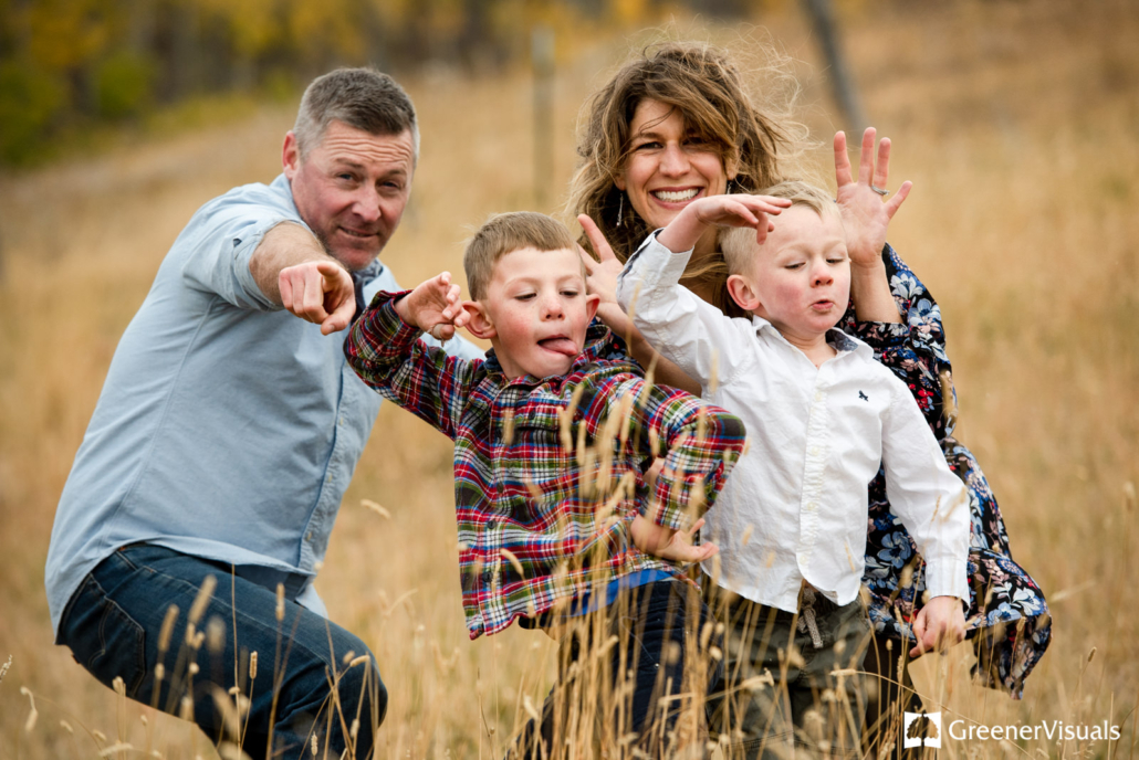goofy-family-makes-funny-faces-during-Triple-Tree-Trail-Family-Portrait