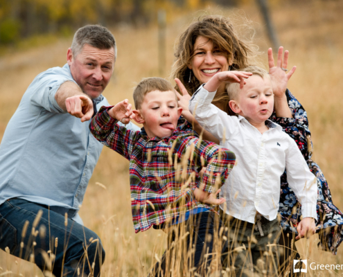 Goofy-family-making-faces-during-portrait-session