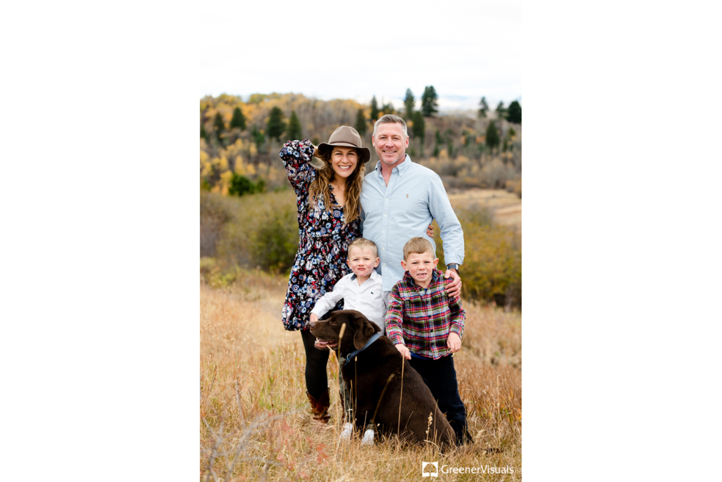 young-family-with-dog-against-smiles-at-Triple-Tree-Trail-Bozeman-Montana