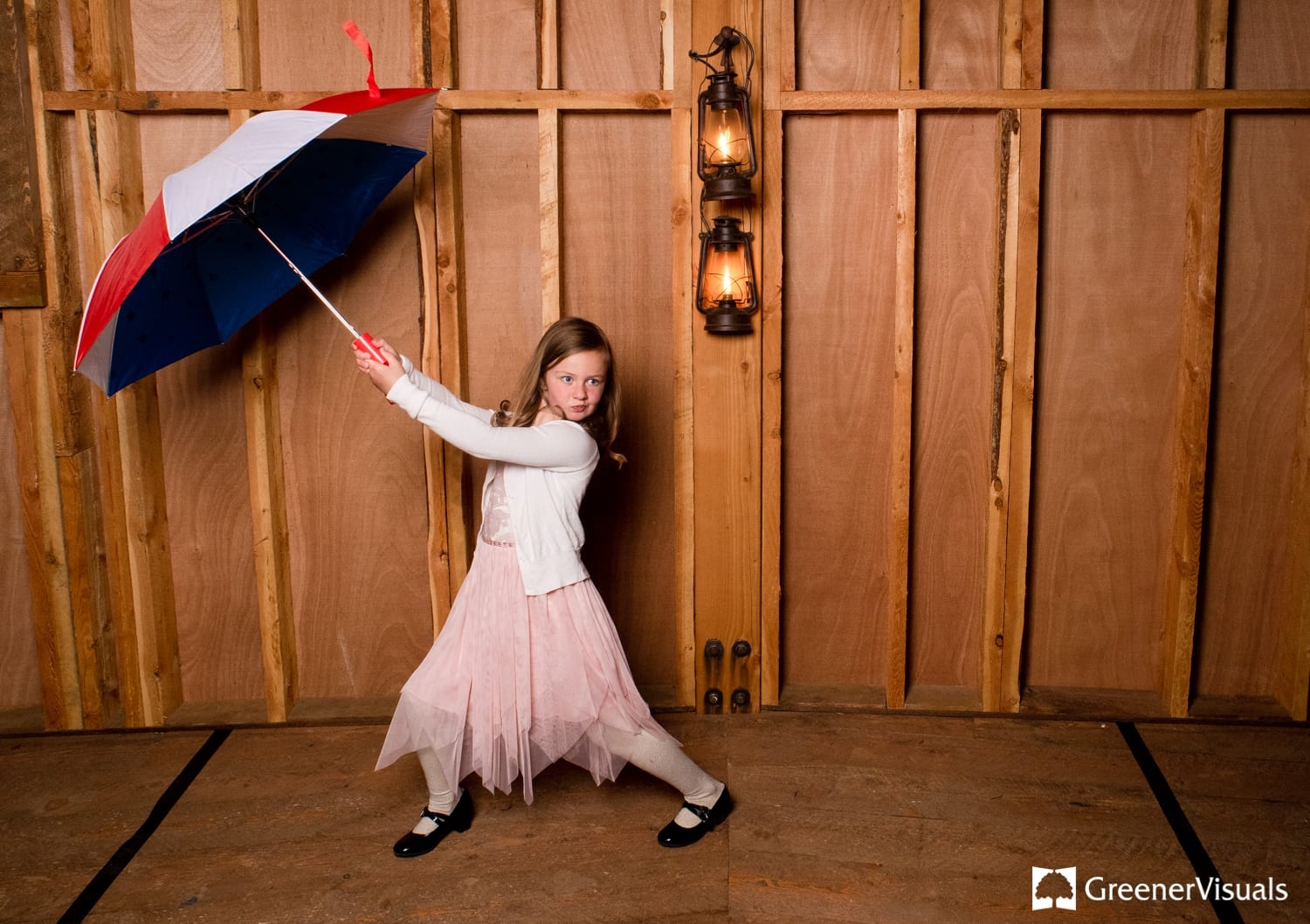 girl-with-umbrella-play-photo-booth-headwaters-ranch