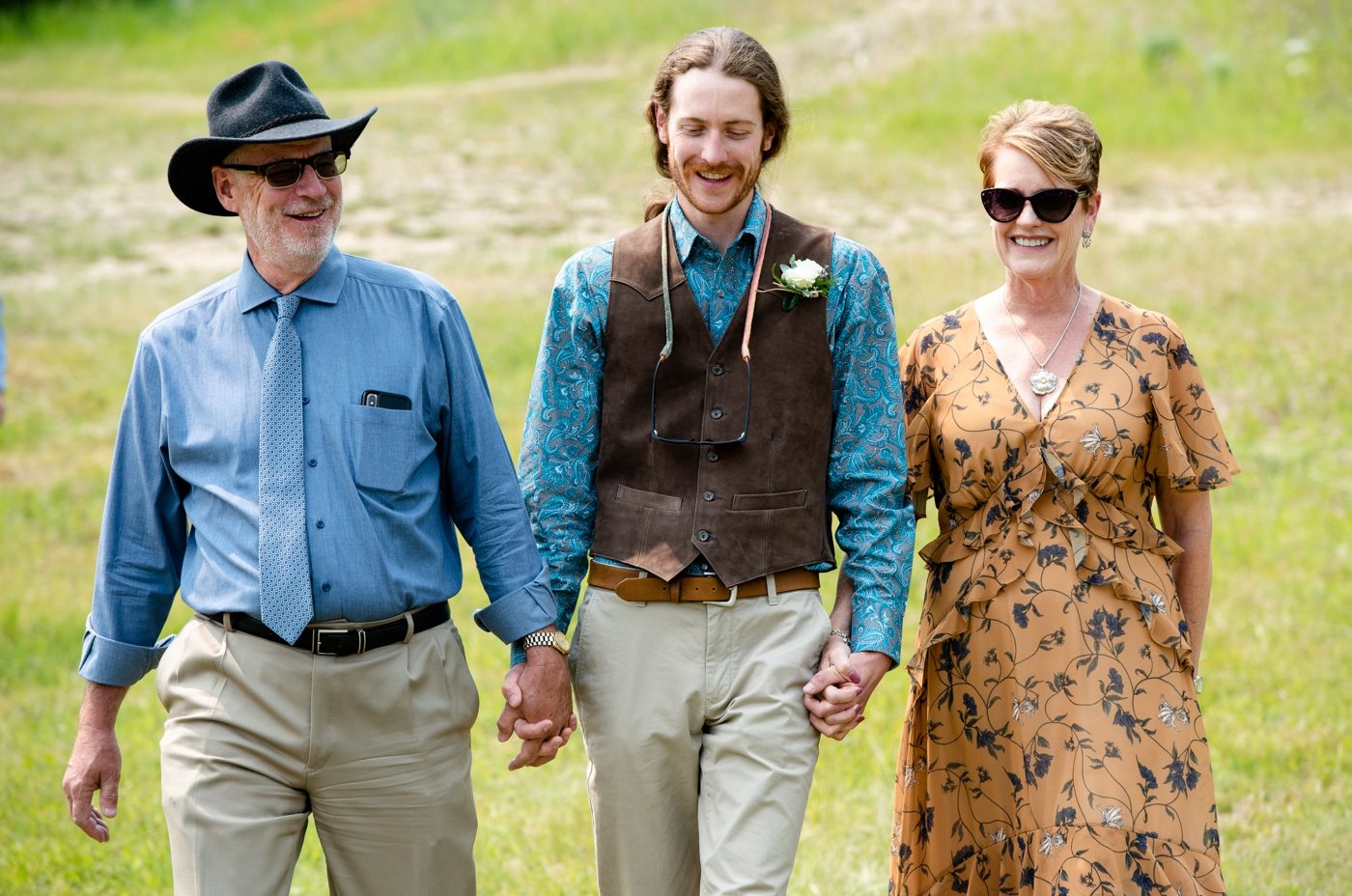 groom-walks-aisle-with-parents