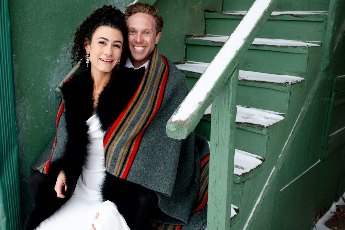 newlyweds-portrait-on-green-stairs-Downtown-Bozeman