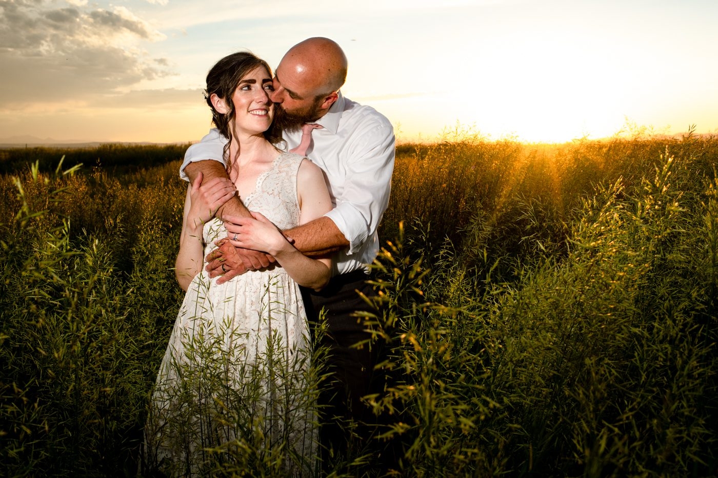 Roys-Barn-Wedding-Bride-Groom-Sunset-Embrace
