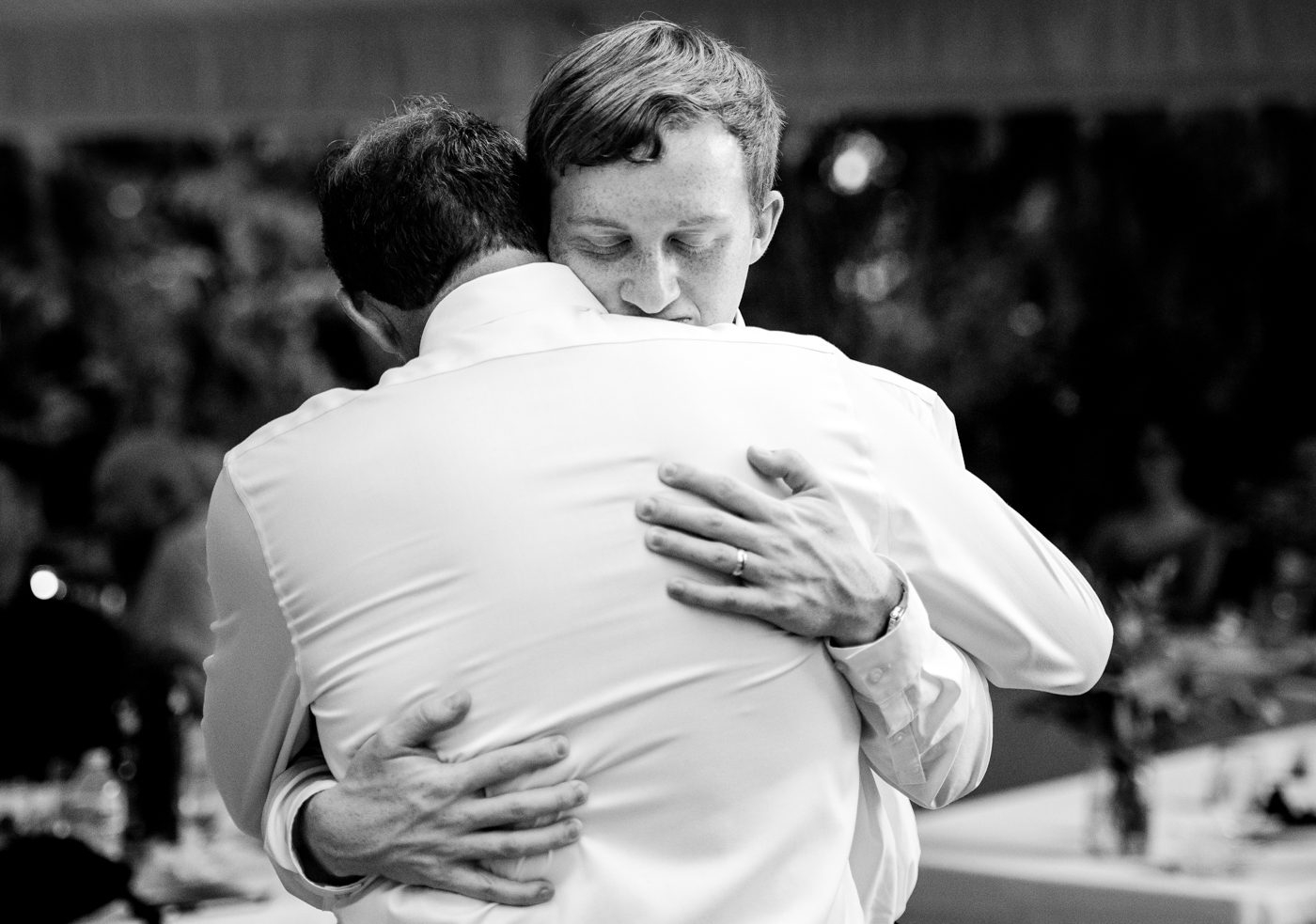 Father-of-groom-hugs-son