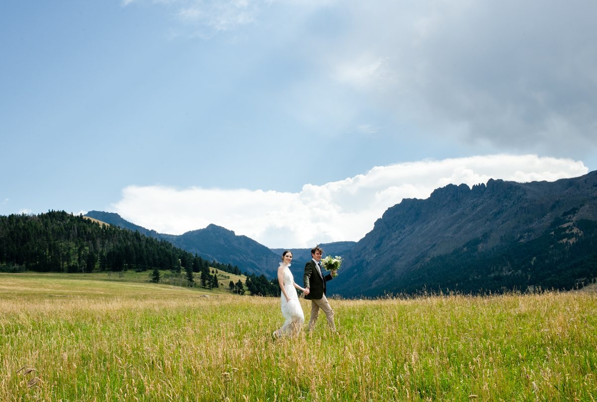 Newlyweds-Walking-Meadow-Grizzly-Creek-Ranch-Wedding