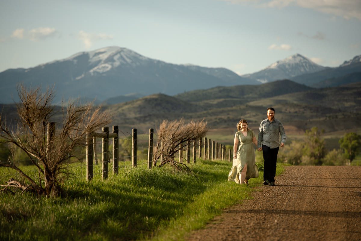 couple-walk-on-country-road-in-Ruby-Valley-Montana