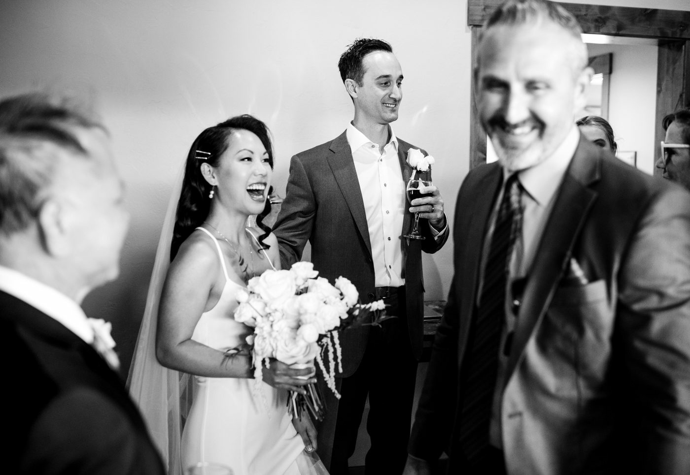 guests-smile-congratulating-couple-after-ceremony-Skyview-at-Fall-River-Village-Resort