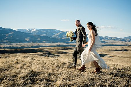 wedding-couple-walk-on-paradise-valley-mountain-landscape-Montana-Elopement-Photographers