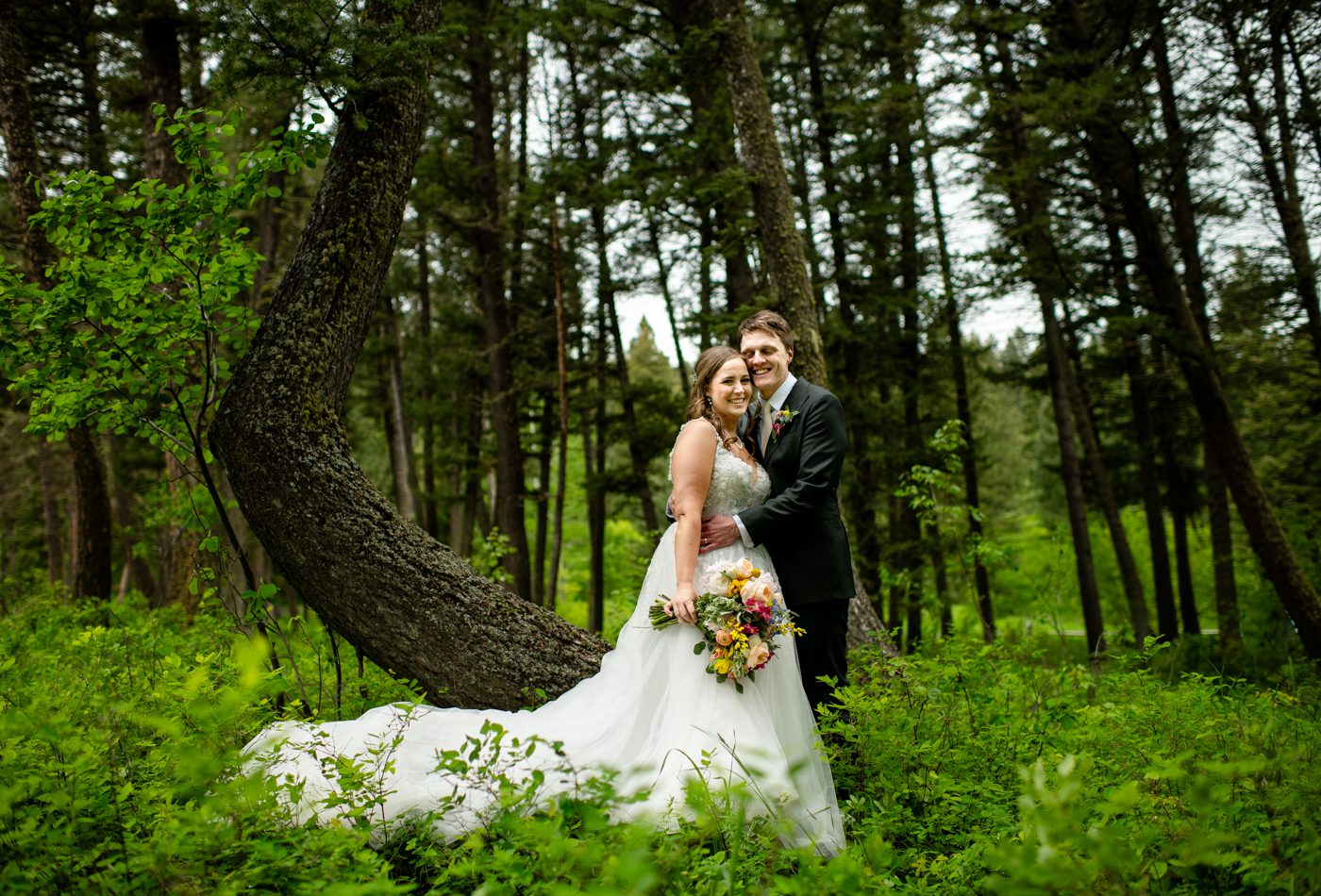 Newlyweds-under-pine-trees-The-Woodlands-Greener-Visuals