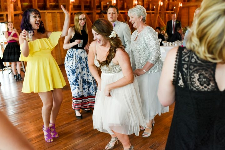 bride-dancing-with-girlfriends-at-Big-Yellow-Barn-wedding