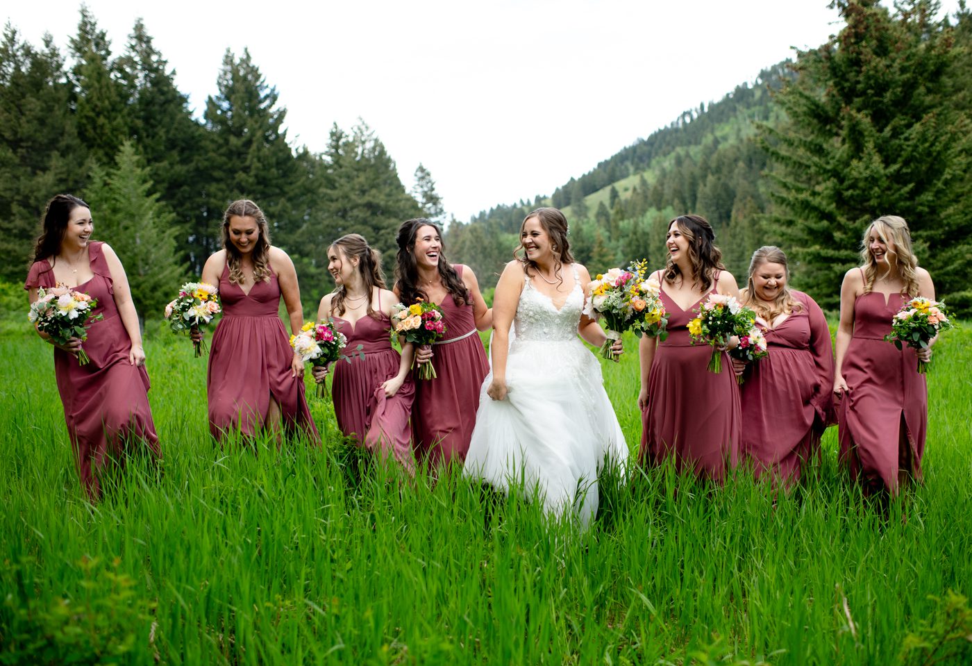 bride-laughs-in-field-with-bridesmaids-at-The-Woodlands-at-Cottonwood-Canyon