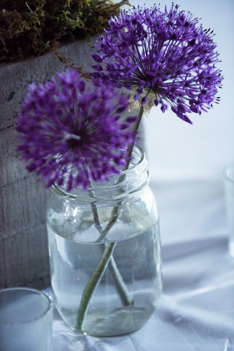 purple-flowers-in-mason-jar-at-Big-Yellow-Barn-wedding