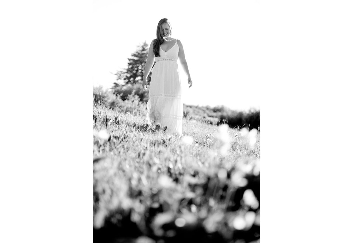 woman-in-white-dress-walking-on-Mount-Ellis-Trailhead