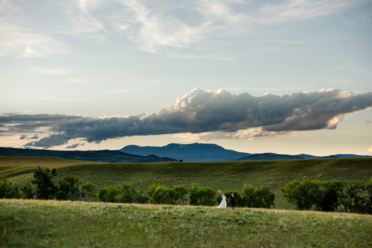 newlyweds-walk-at-sunset-in-madison-river-valley