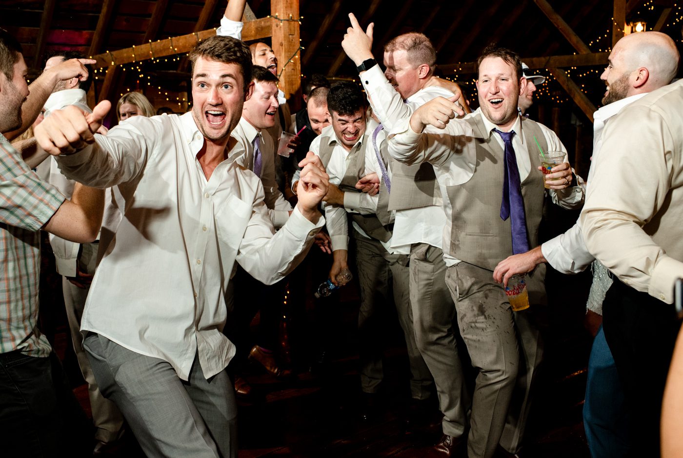 Groom-with-groomsment-dance-and-sing-at-roys-barn
