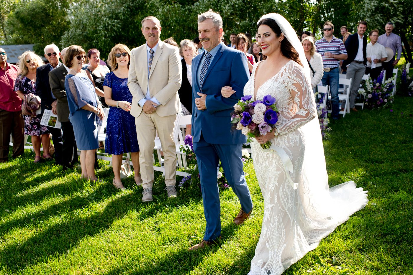 bride-walks-down-aisle-with-father-roys-barn-wedding