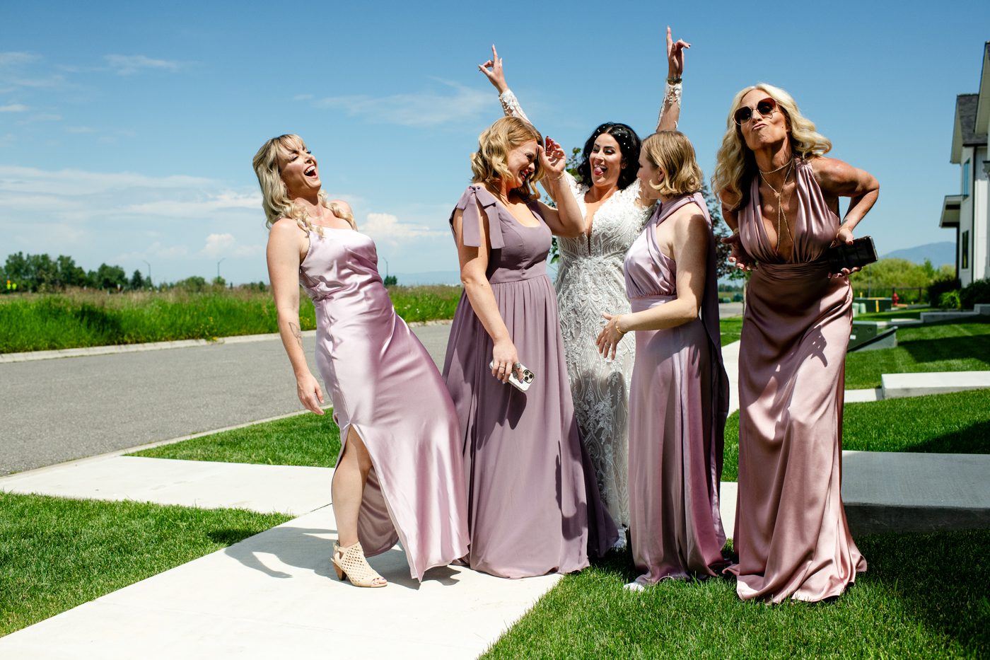 bride-with-bridesmaids-get-silly-before-wedding-ceremony