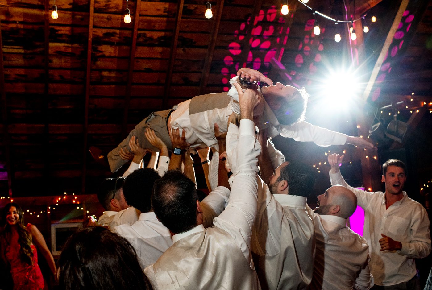 groom-lifted-by-groomsmen-on-dancefloor