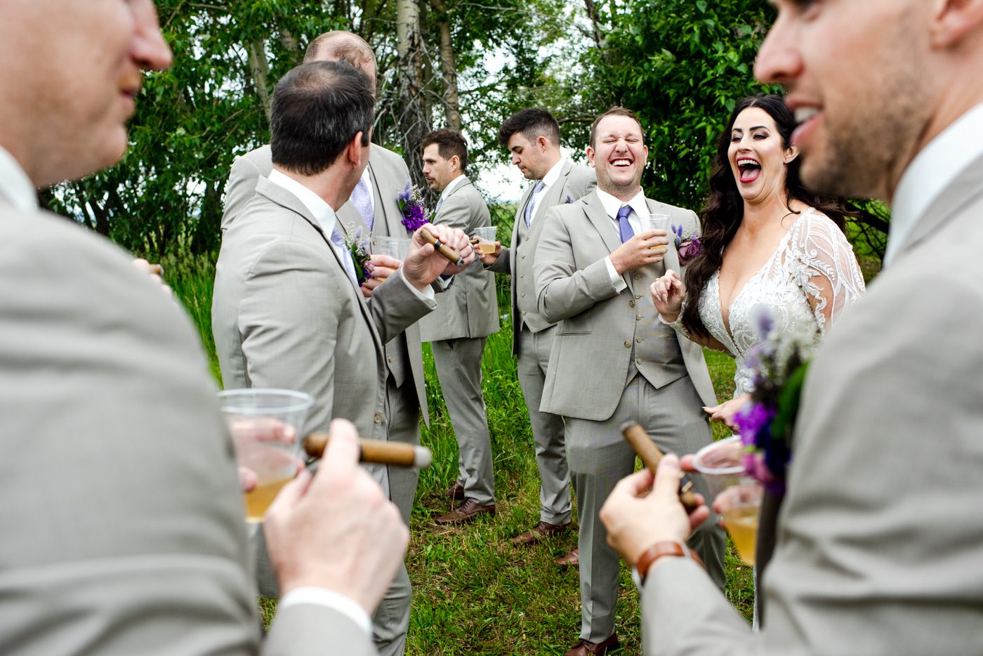 laughing-wedding-couple-enjoy-cigar-bar-at-roys-barn-wedding