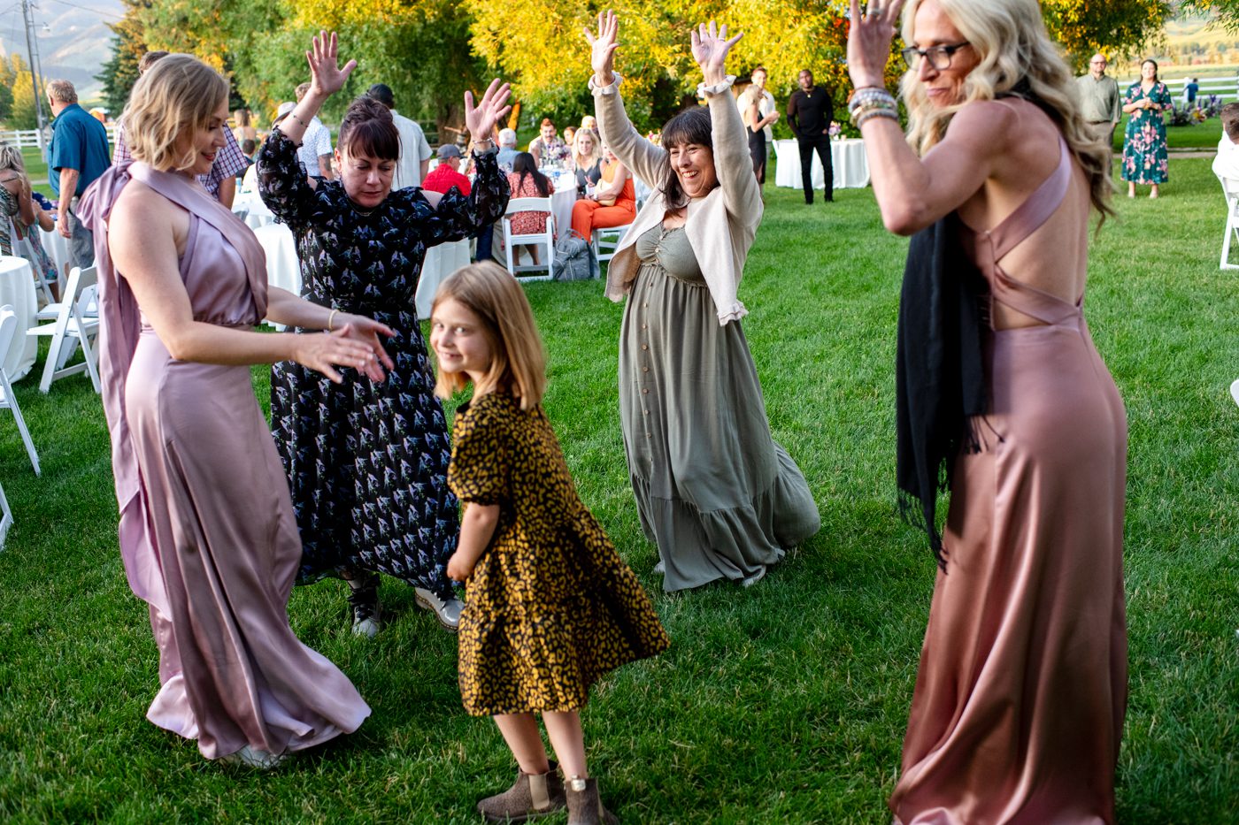 young-girl-dance-lessons-from-family-at-wedding