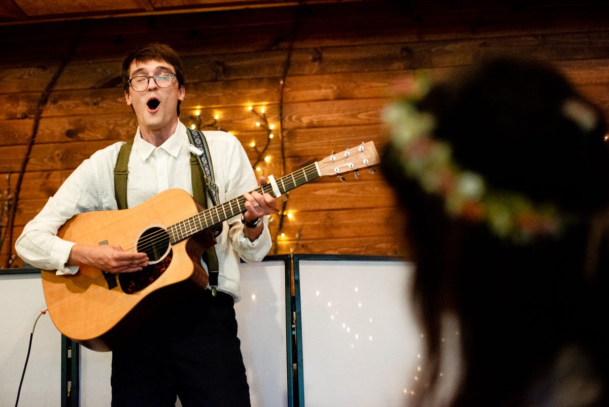 groom-sings-to-bride-at-Gallatin-River-Hideaway-wedding